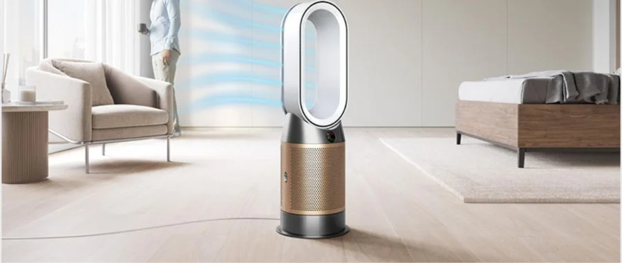 Dyson Purifier Hot+Cool Formaldehyde HP09 in a room blowing purified air at a man in the corner