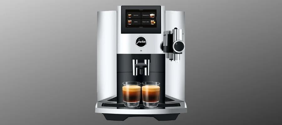 A silver Jura S8 coffee machine with two shots of espresso sitting on the tray