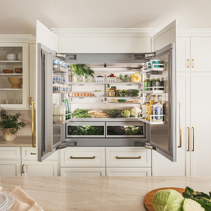 Thermador refrigerator with open-face deli drawers showcasing a variety of fresh fruits neatly organized inside