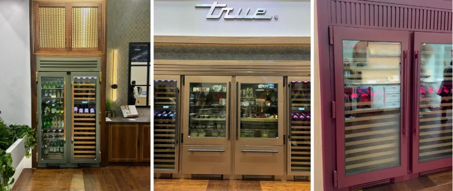 Three different refrigerators from the true residential booth at KBIS 2025: the evergreen wine cooler, a classic stainless steel refrigerator, and a purple wine cooler