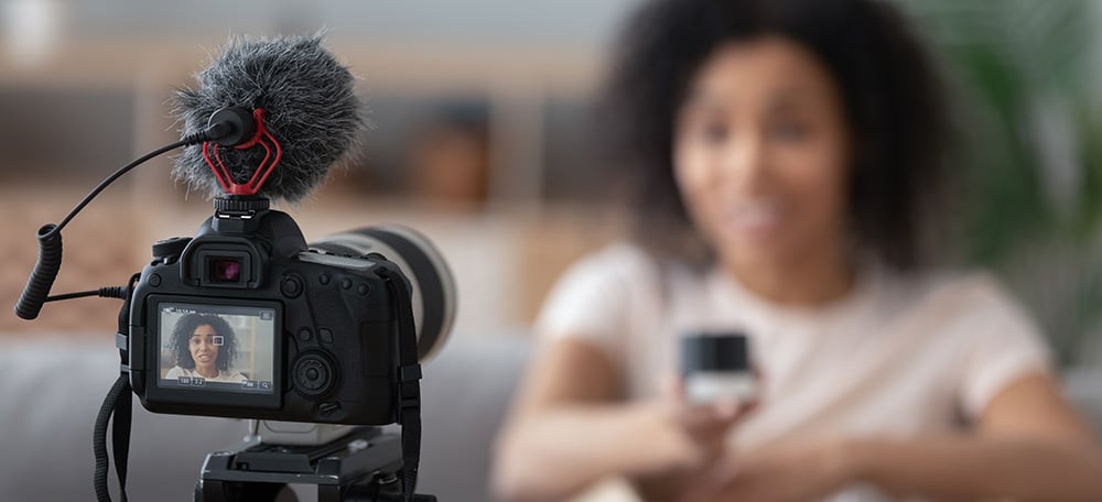Woman vlogging with focus on camera