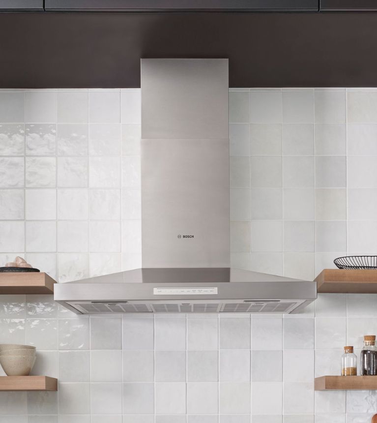 Modern kitchen with a Thermador built-in wine refrigerator and a stylish island, highlighting elegant design and functional luxury
