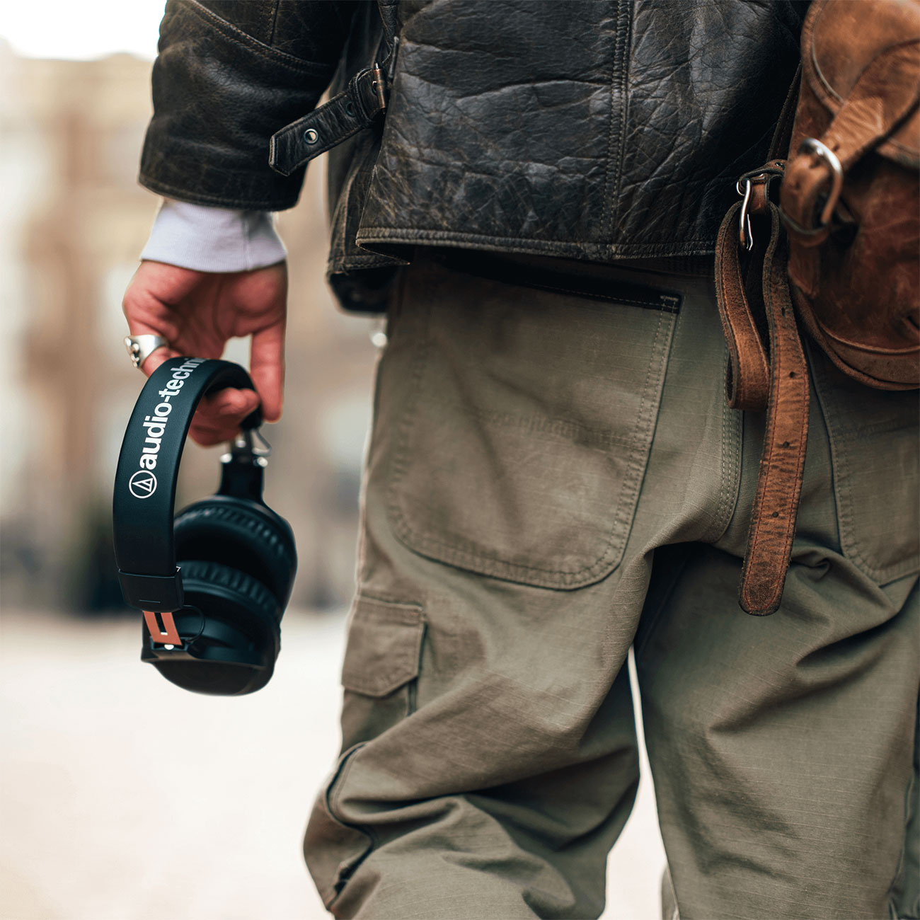 Man Carrying Audio-Technica Headphones Outdoors