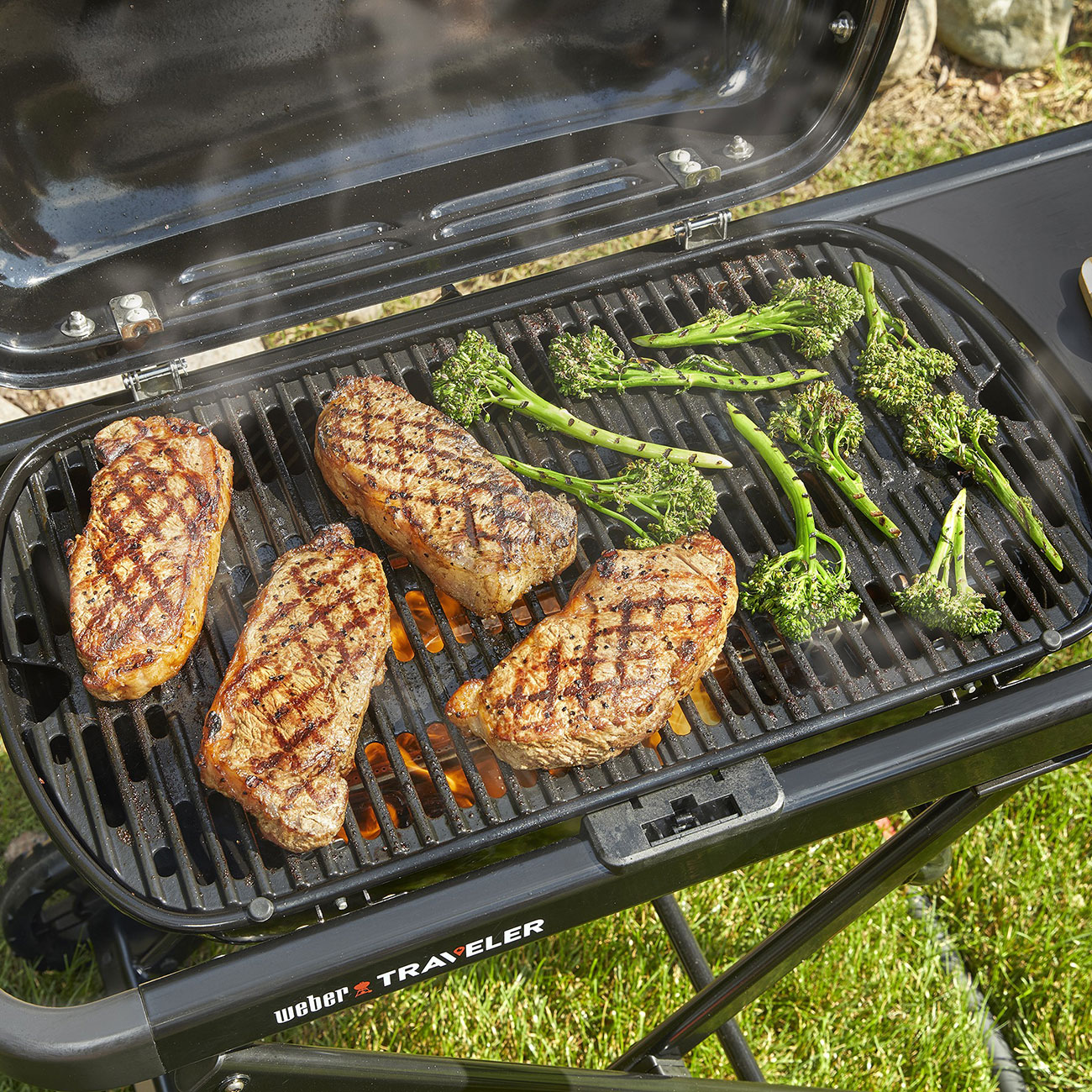 Top angled view of Weber Traveler Portable Liquid Propane Gas Grill
