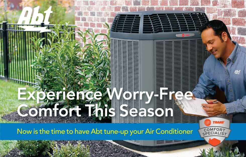 Abt HVAC installer with checklist near an AC unit
