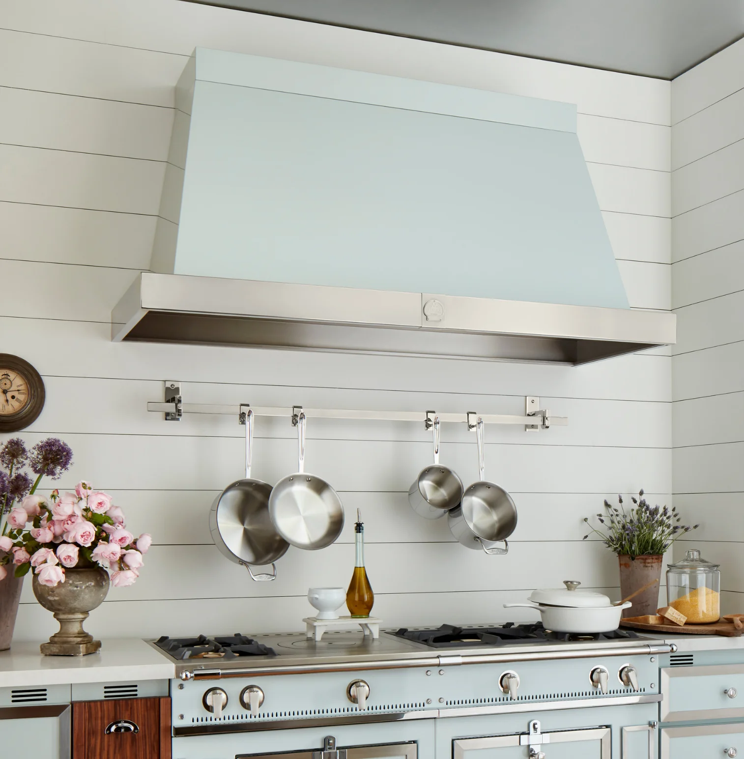 La Cornue range hood installed above a Château range in a kitchen