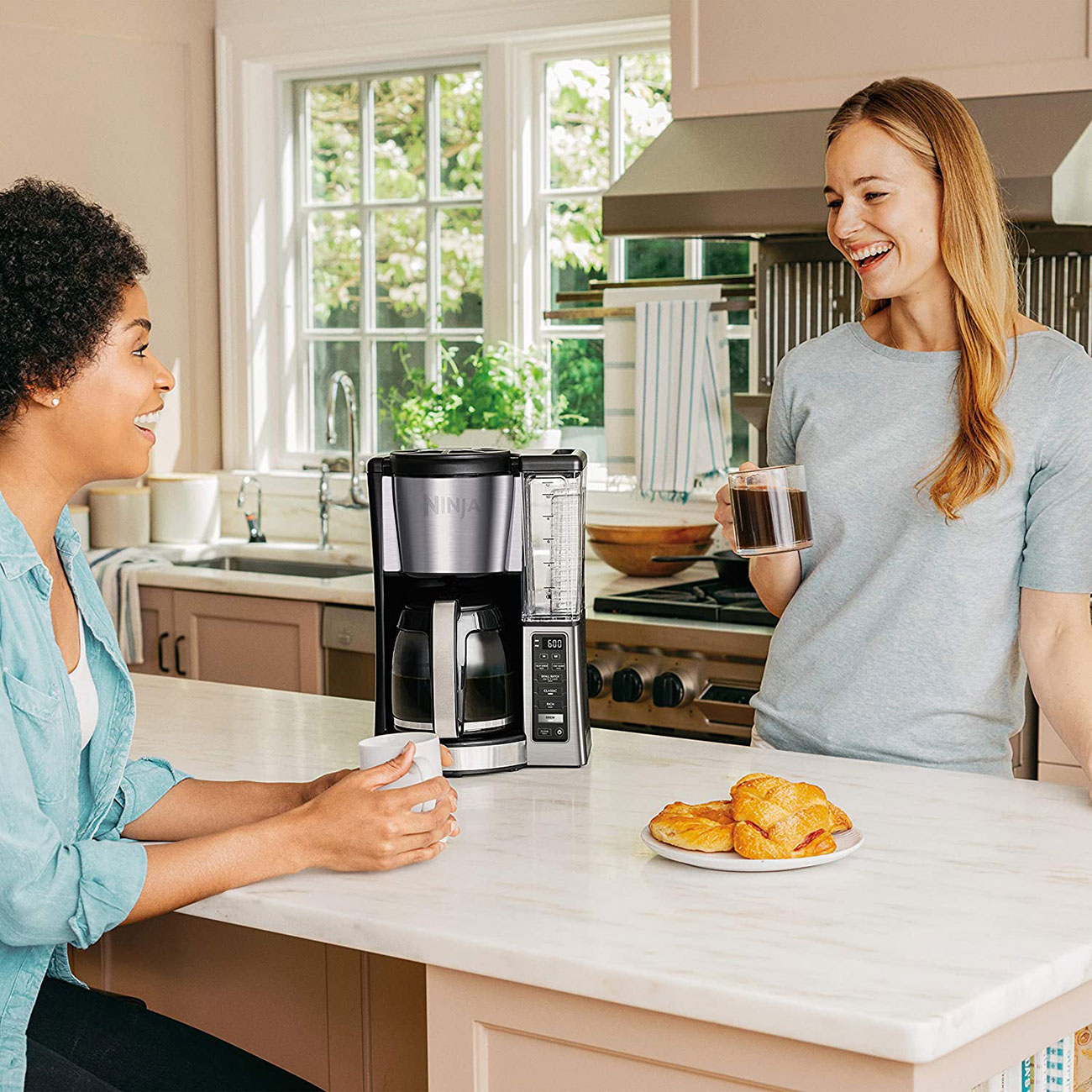 Woman Enjoying Standing by Ninja Coffee Maker in Kitchen