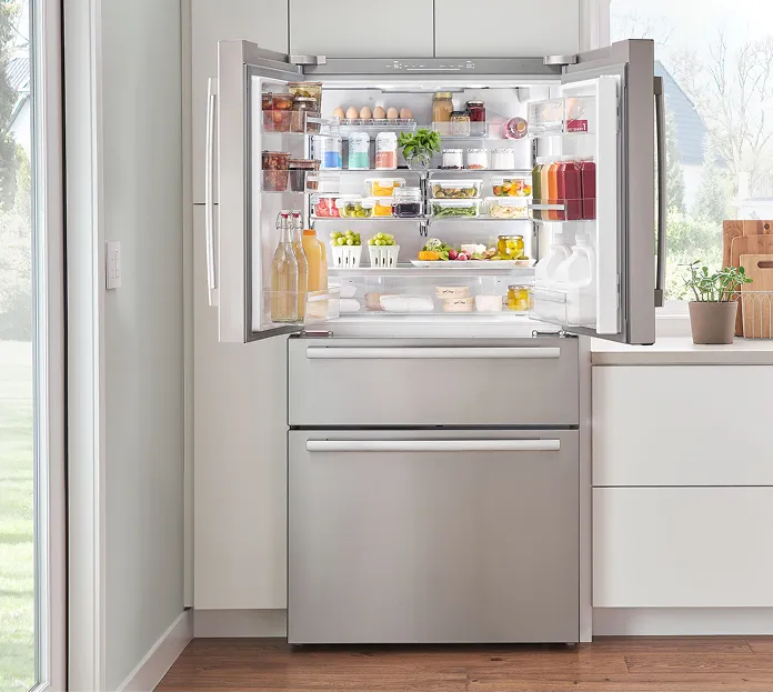 Open built-in refrigerator in a bright kitchen