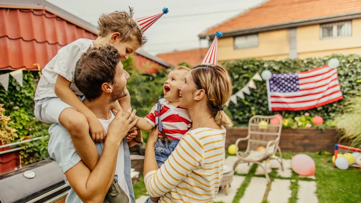 family wearing patriotic party hats