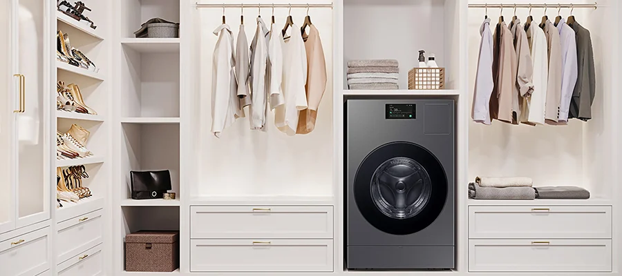 A silver Samsung laundry combo built into a minimalistic white closet
