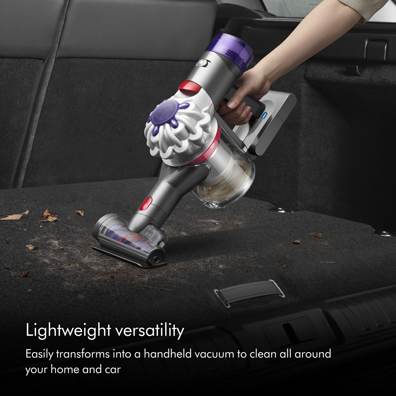 Dyson V8 Cordless Stick Vacuum Sued By a Person to Clean Inside a Car
