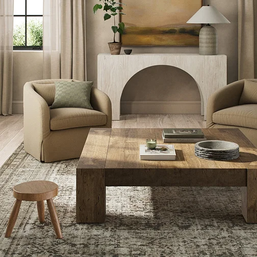 A well-furnished living room showcasing a couch, a chair, and a table, designed for comfort and conversation.