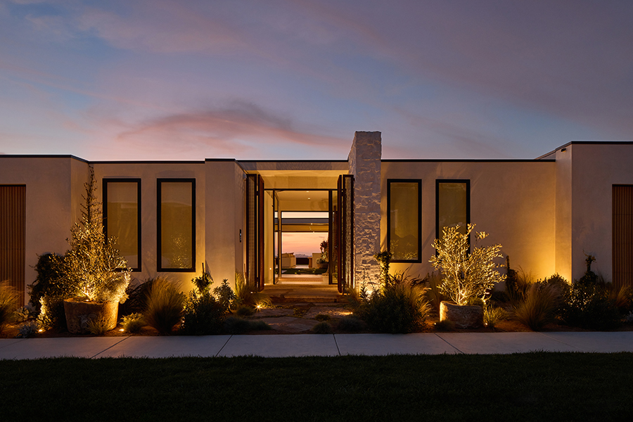 Coastal Source lit outdoor dining and landscape