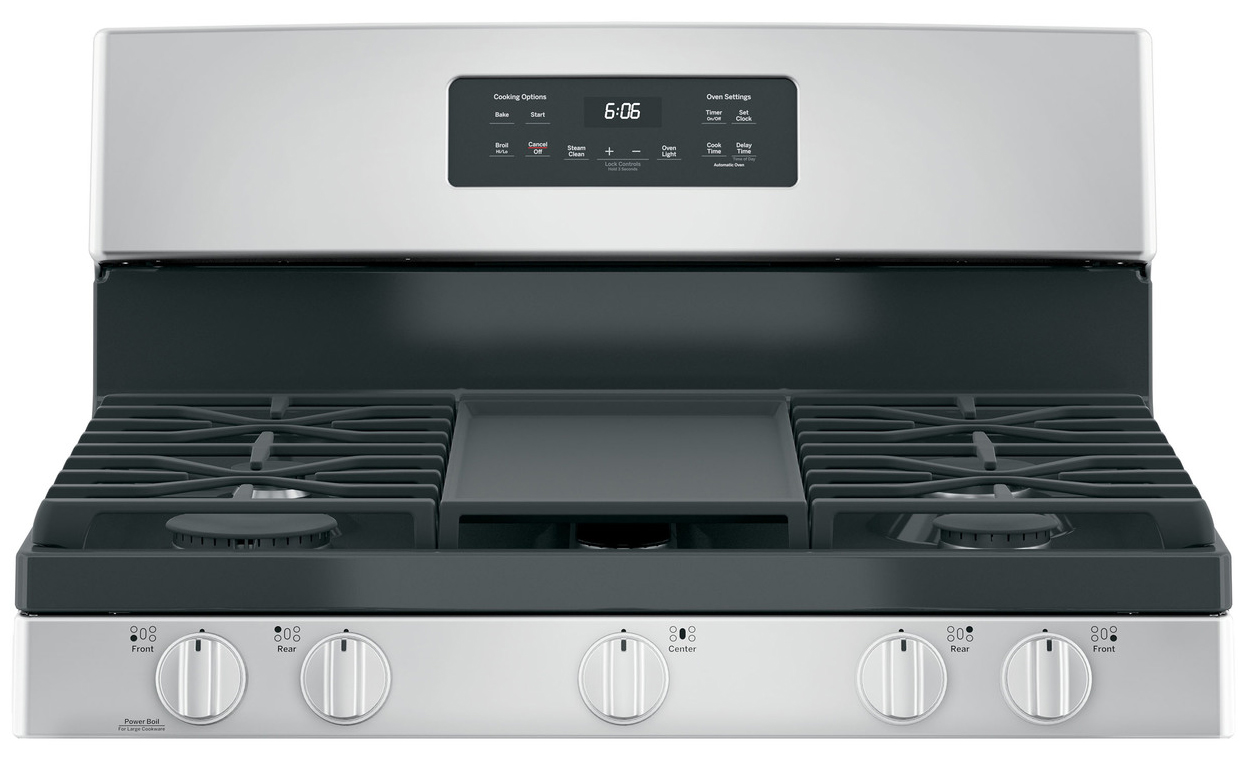 Close-up of cooktop of and oven control panel.