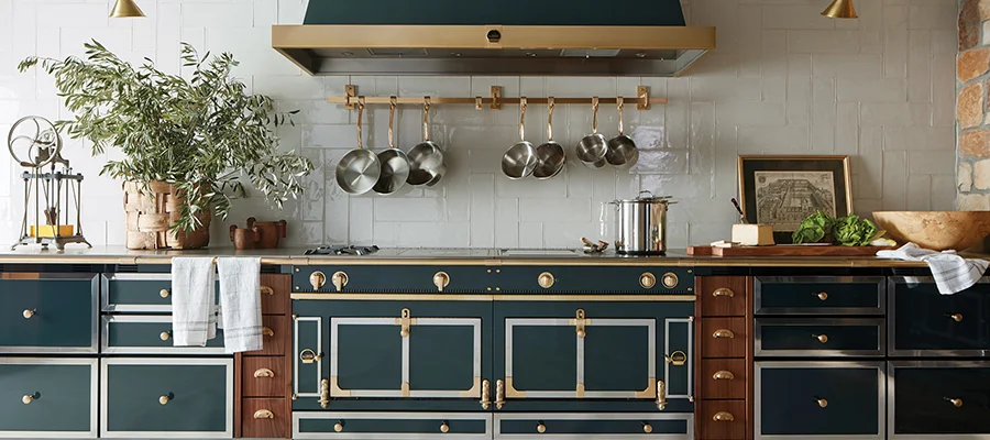 Dark green cooking appliances installed in a luxury kitchen