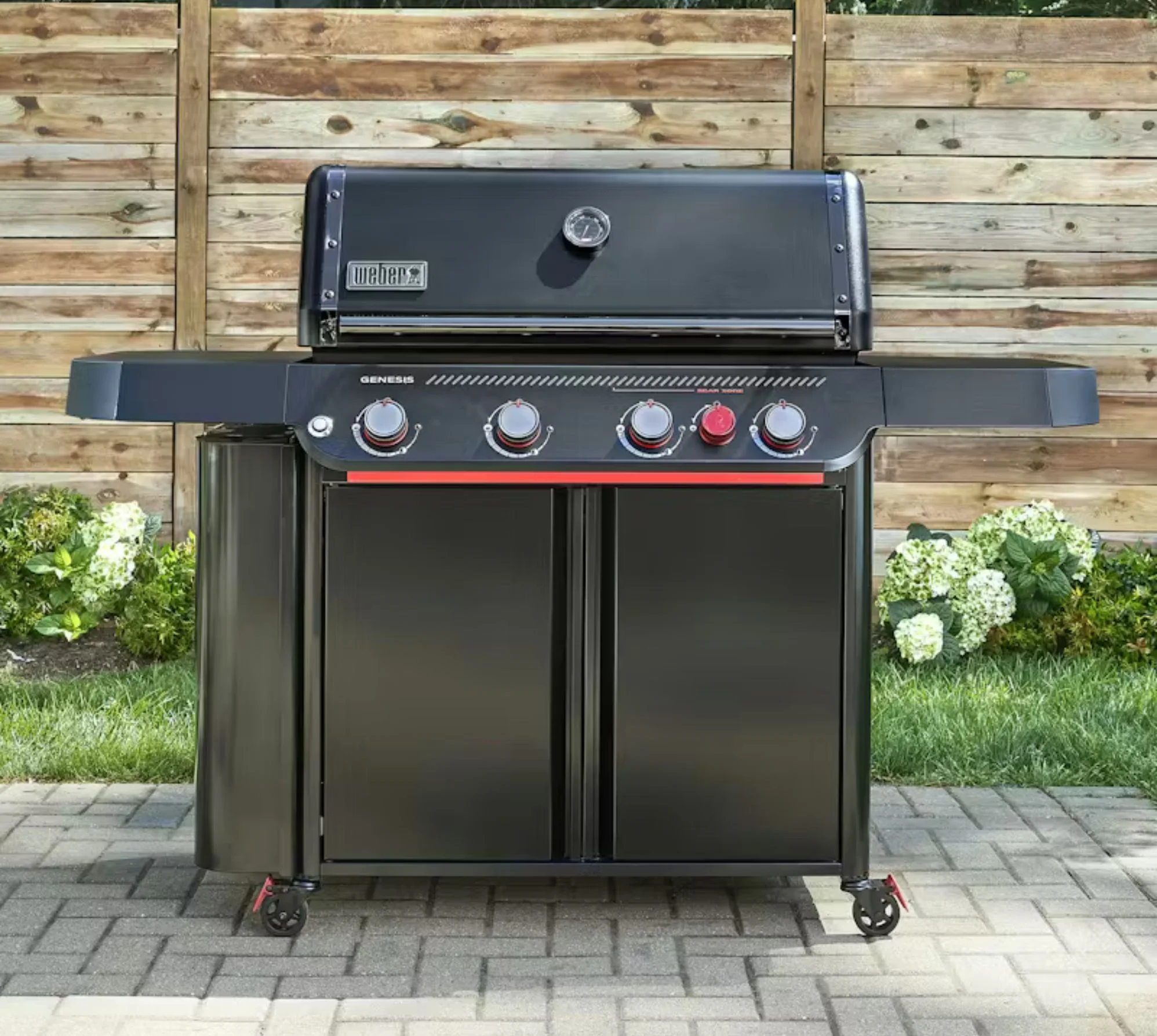 A Weber Genesis E-430 close up so you can see the unit in a backyard