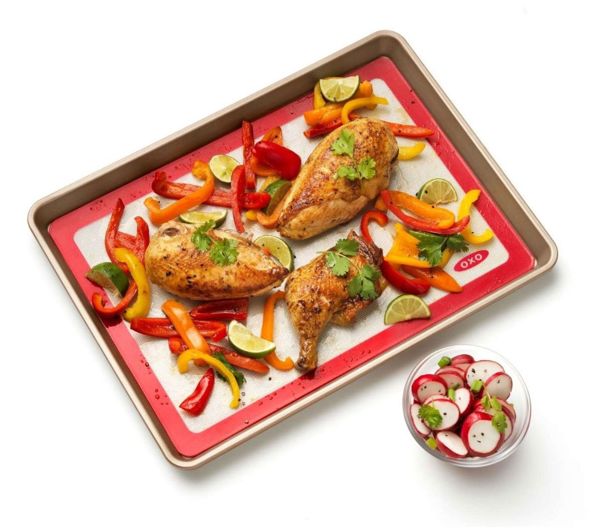 View of Baked Chicken & Veggies On OXO Baking Mat 