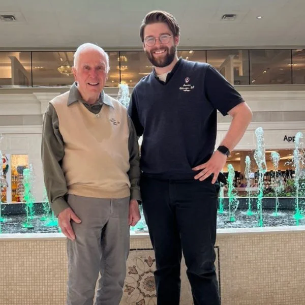 Tom and Saxon Kotowski in front of the big fountain in Abt's atrium