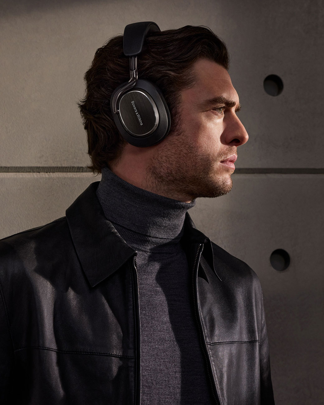Man Using Bowers & Wilkins Noise Canceling Headphones