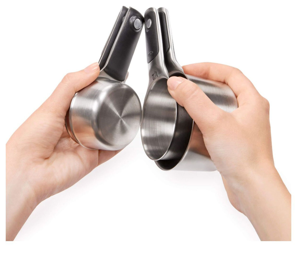 Person Stacking OXO Measuring Cups