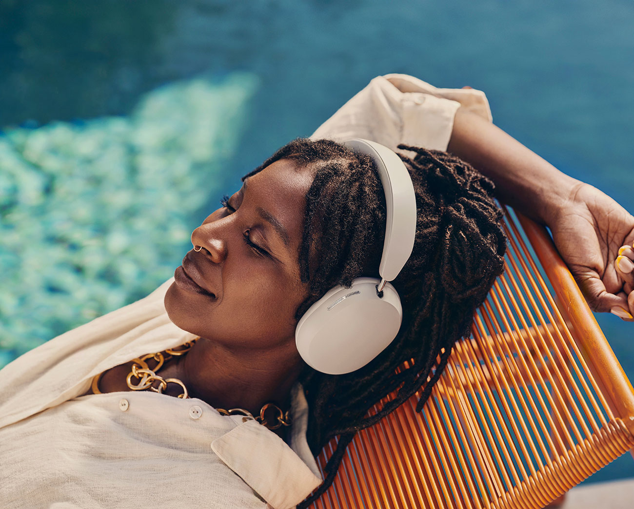 Woman Using Sonos Noise Cancelling Headphones Indoors