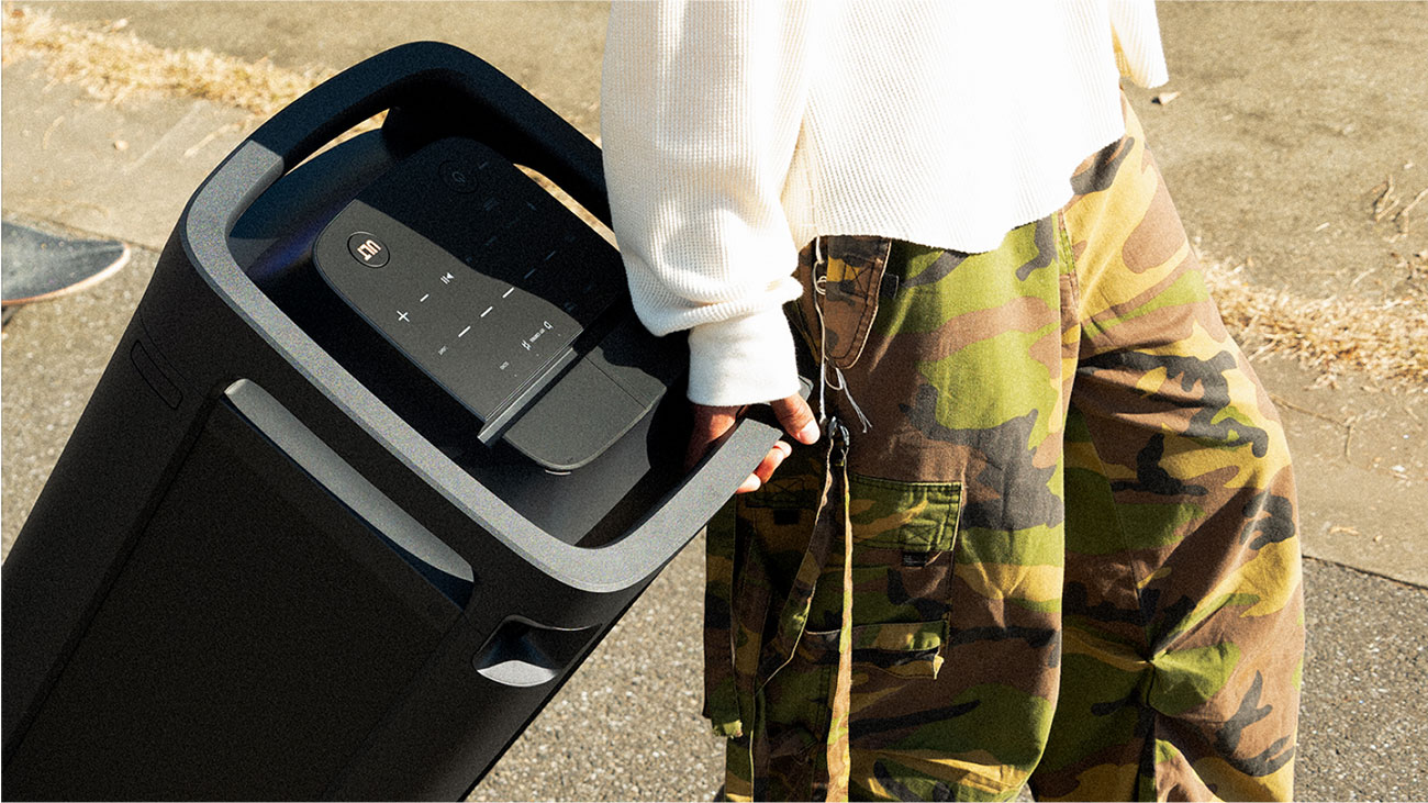 Front View of Person Carrying Sony Bluetooth Portable Speaker