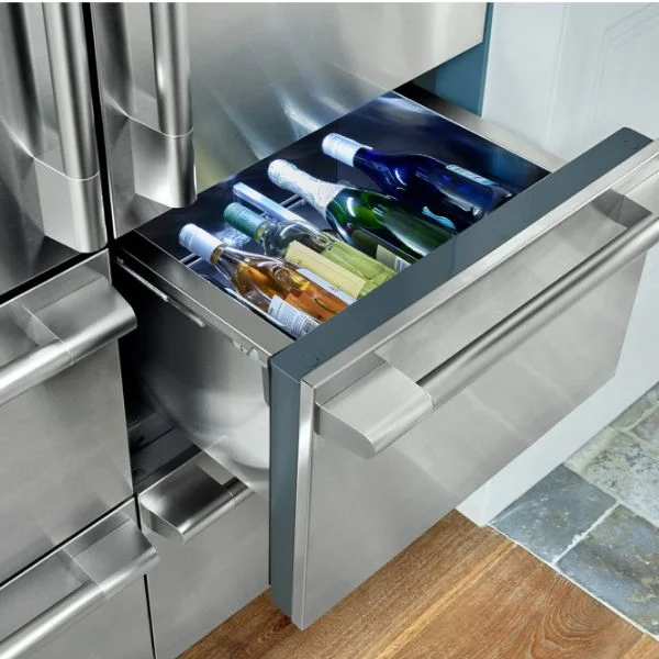 Opened convertible drawer on an SKS refrigerator with wine inside.