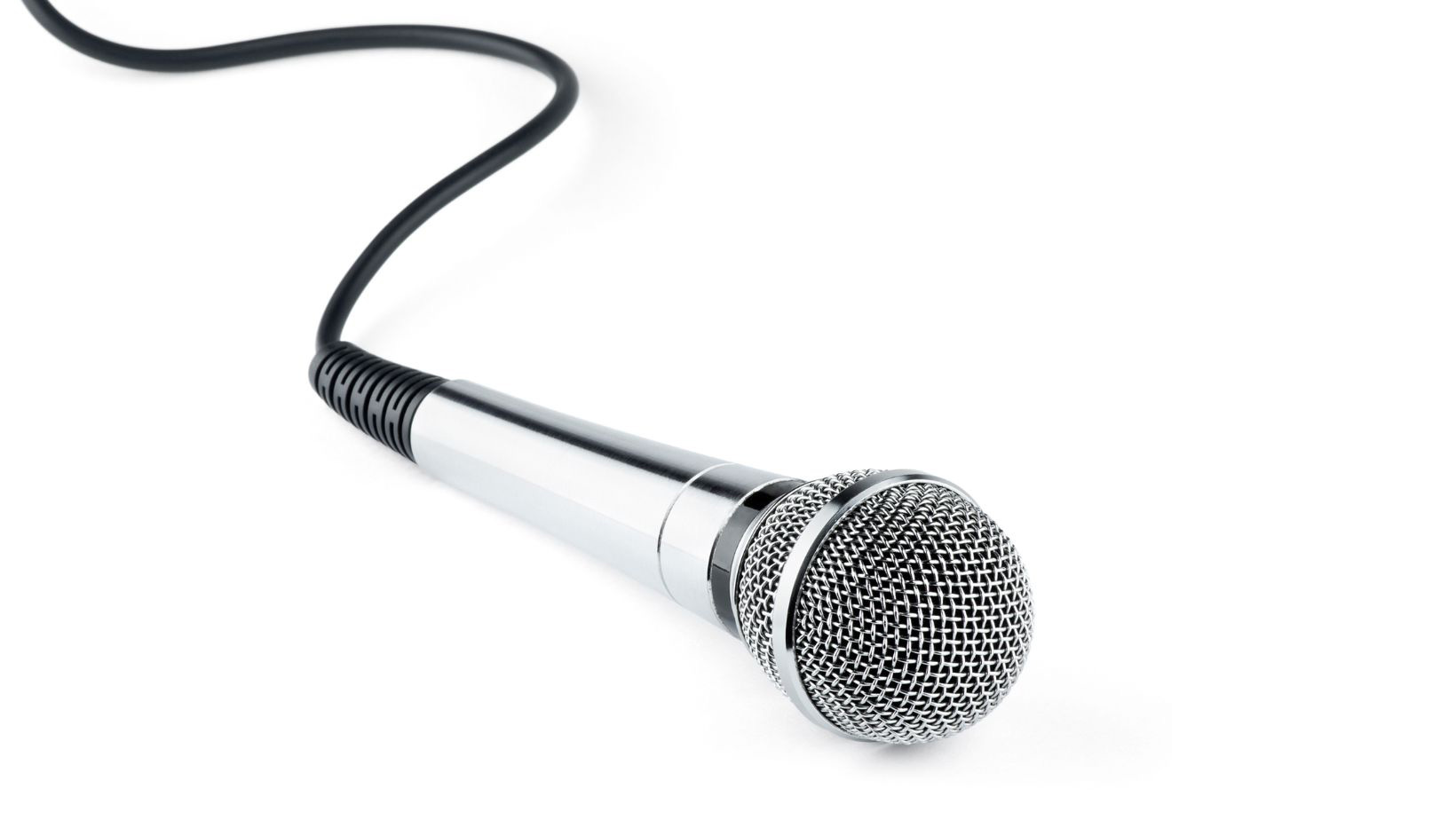 Silver dynamic microphone laying flat on a white background