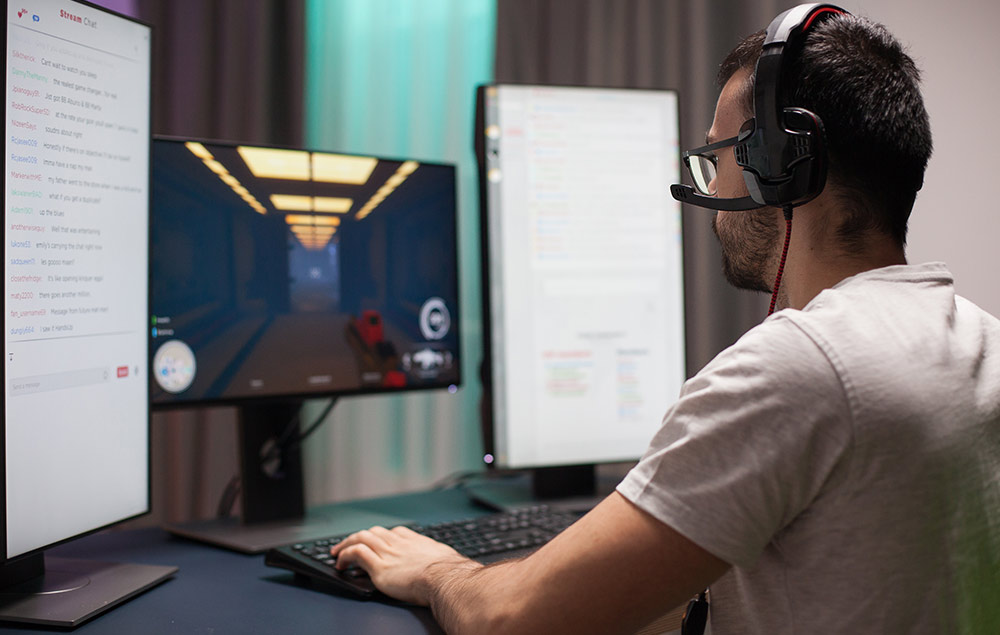 Person using three pivot monitors.