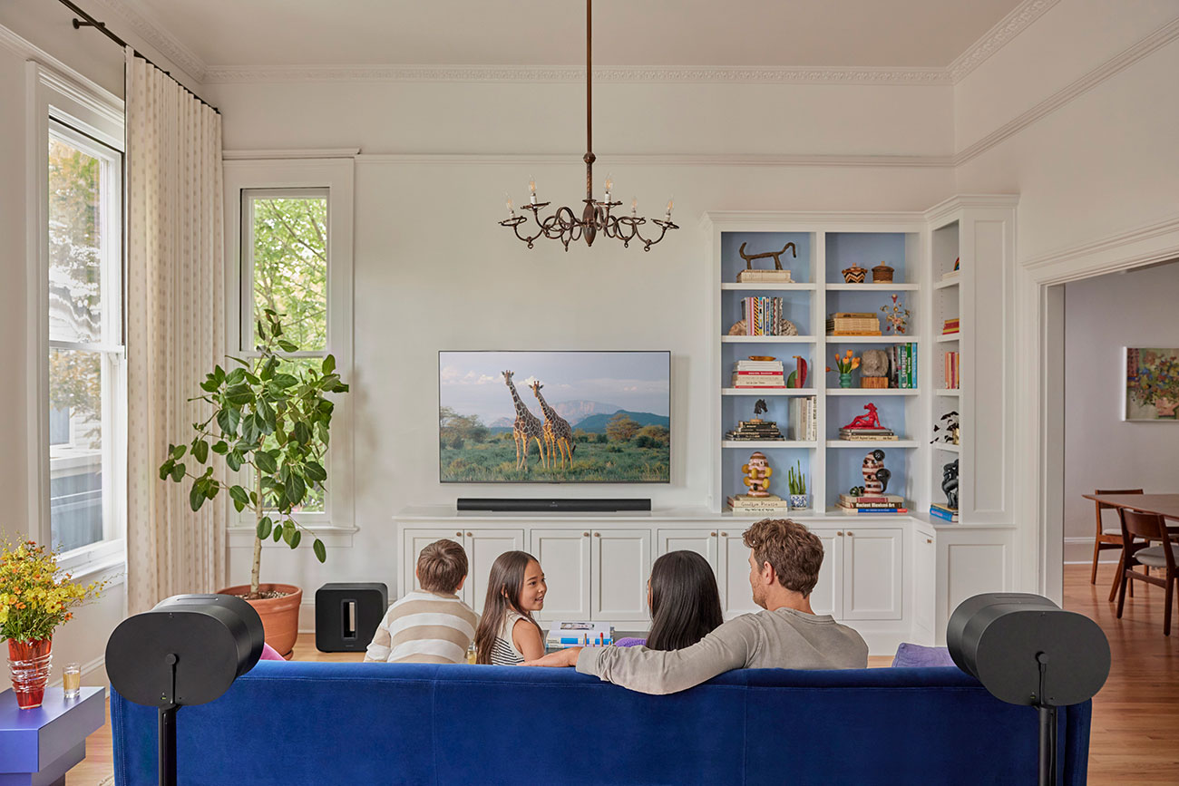Family Listening to SONOS Subwoofer in Living Room