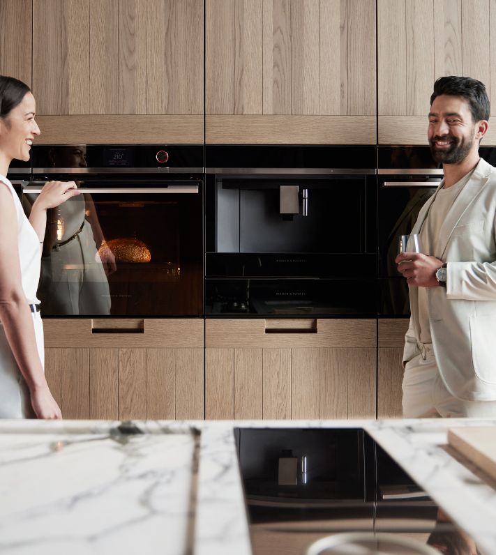A stainless steel Gaggenau built-in microwave oven featuring a sleek digital display for modern kitchen aesthetics