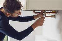 Person fixing pipes