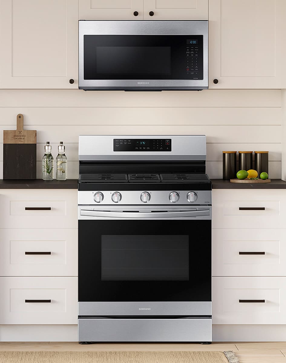 Front view of range installed in kitchen under microhood