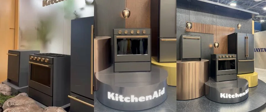 front and side views of black KitchenAid dishwasher, range and refrigerator