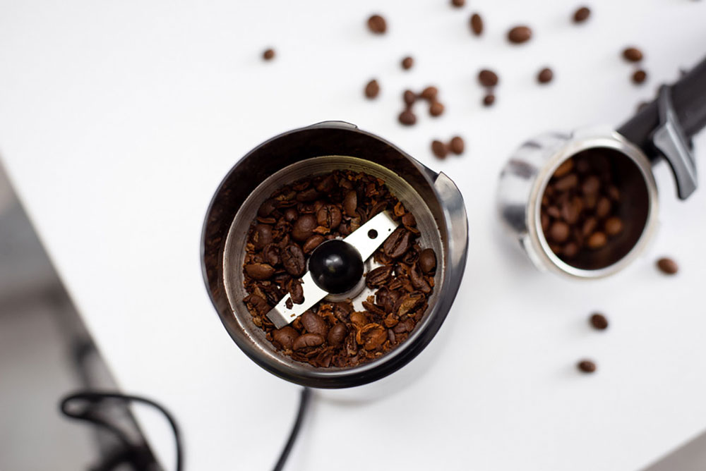 Coffee grinder with partially ground coffee beans