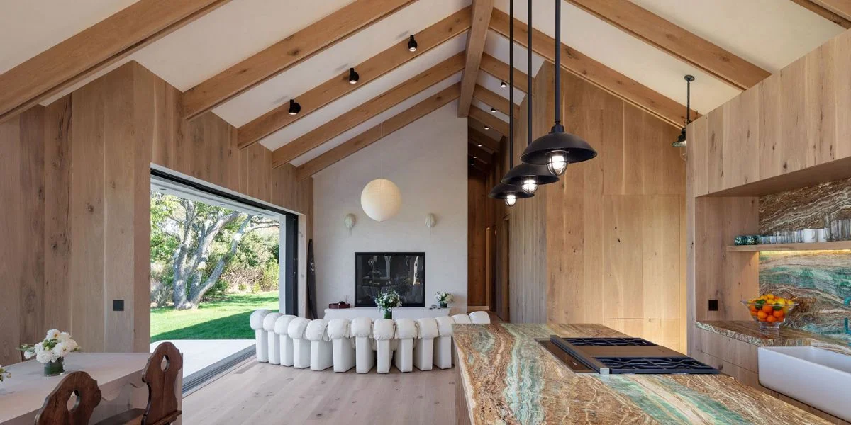 Open concept kitchen with natural woon accents and designed with smart lighting