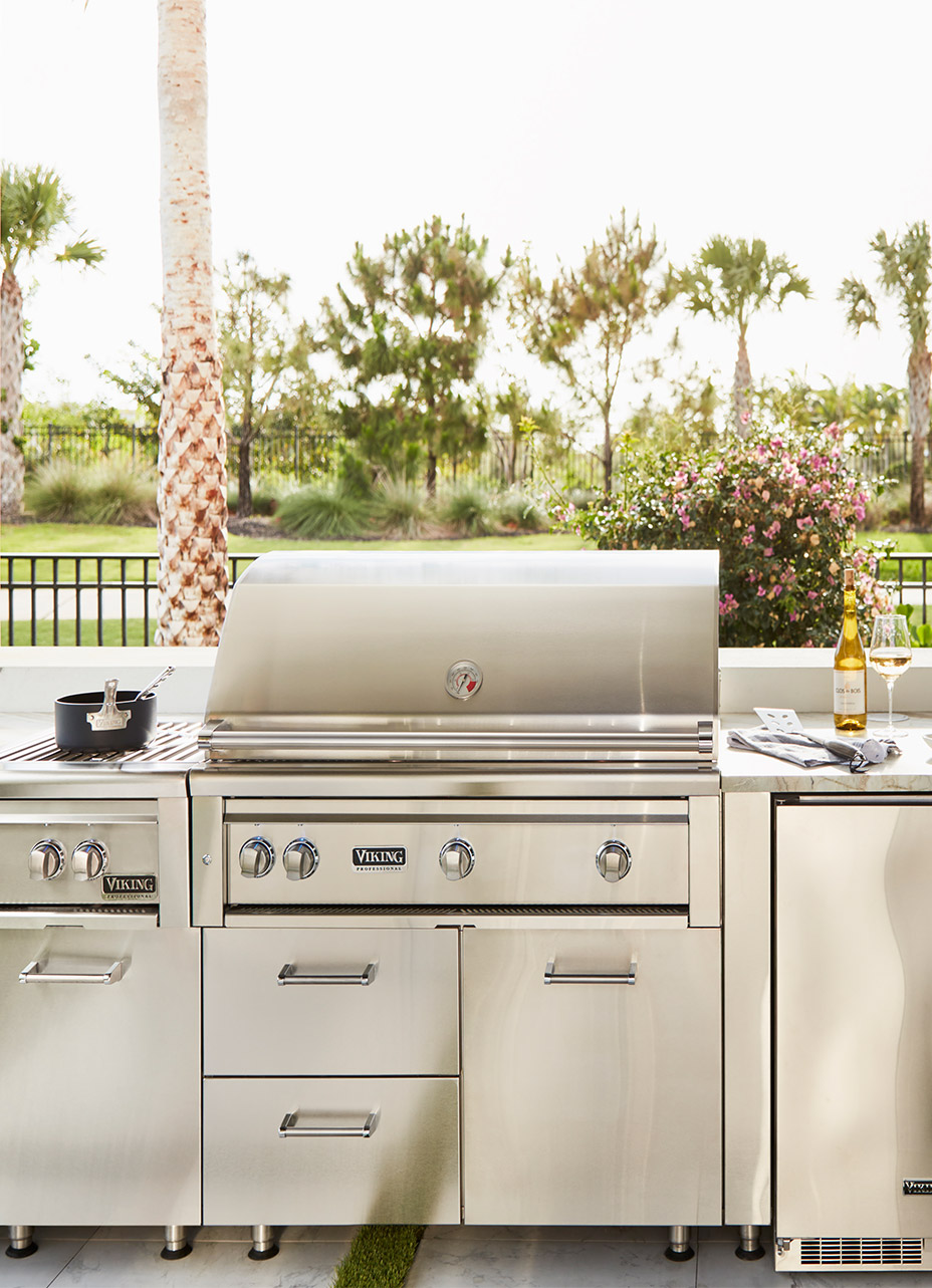 Close up on a viking outdoor built in grill fitted with under storage, side burners and outdoor refrigerator