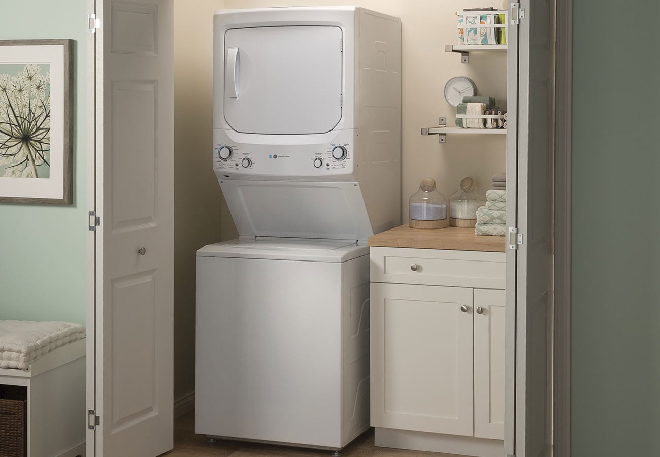 Stacked washer and dryer in laundry room