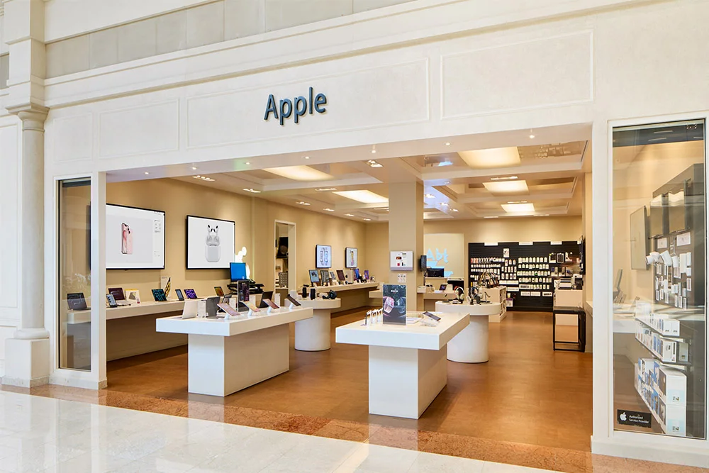 Apple boutique in the atrium of Abt, highlighting a contemporary layout with a range of Apple products on display