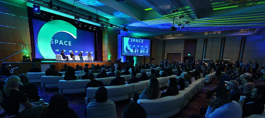 A crowd of attendees watching a keynote presentation at CES 2024.