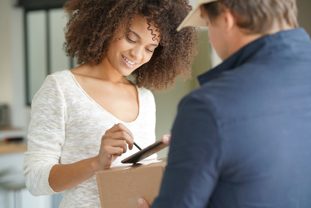 Woman Signing for Package