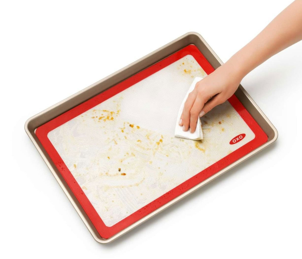 View of Person Cleaning Up OXO Baking Mat