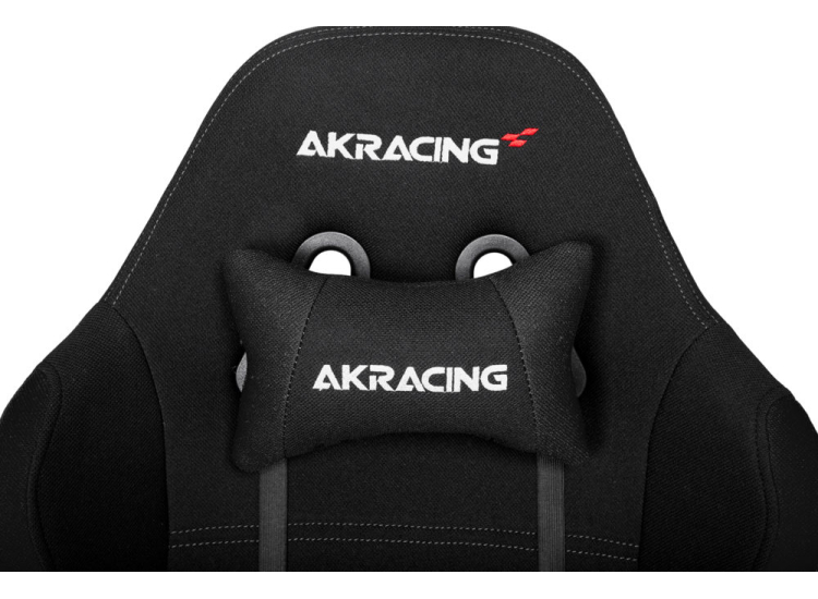 Close-up of AKRACING branding on headrest pillow and chair back.