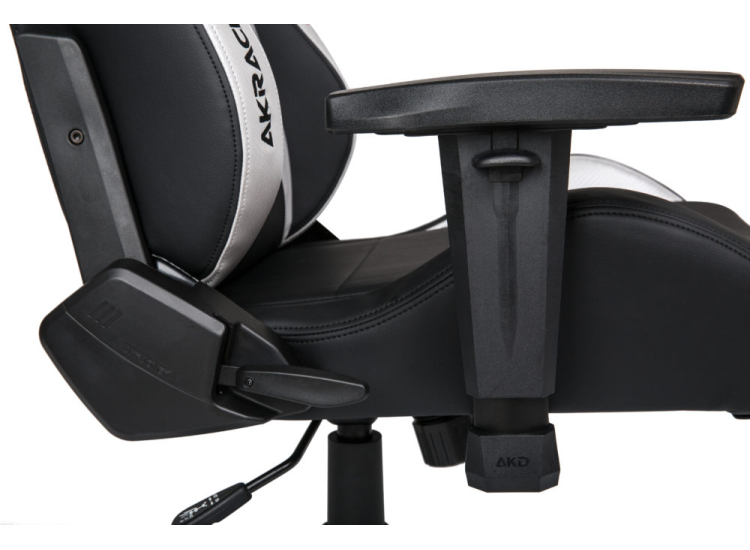 Front view featuring integrated headrest cushion and armrests on AKRACING chair.