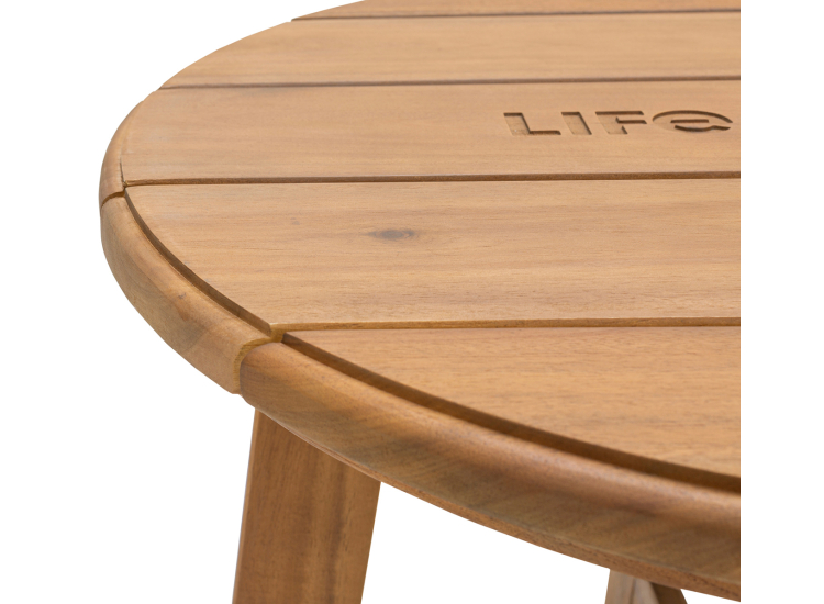 A close-up of a wooden stool with the word 'Life' engraved on it.
