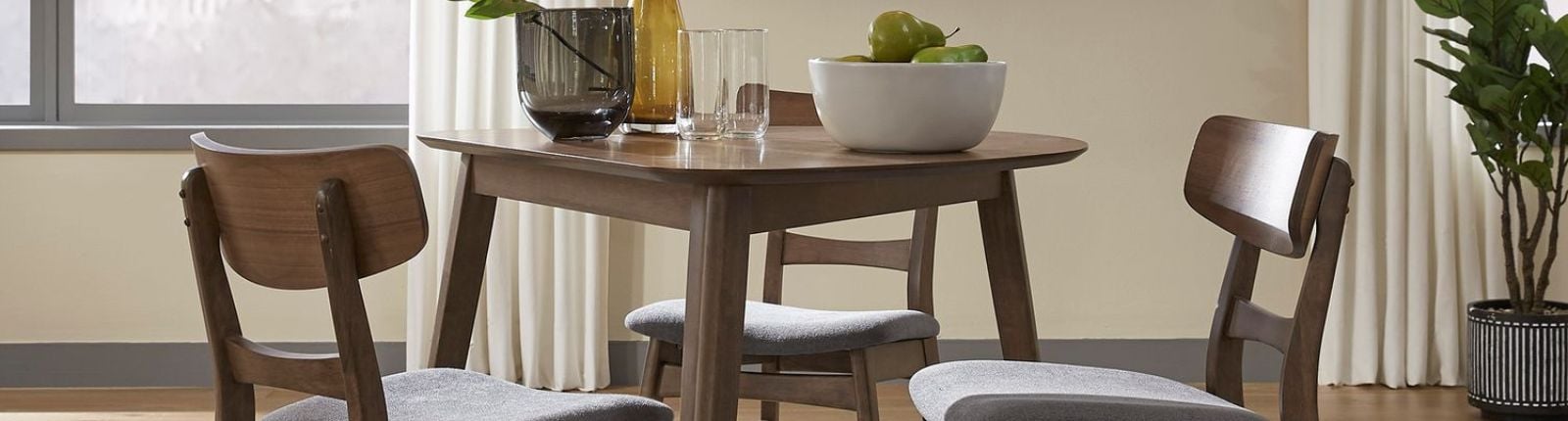 A round table set with three chairs
