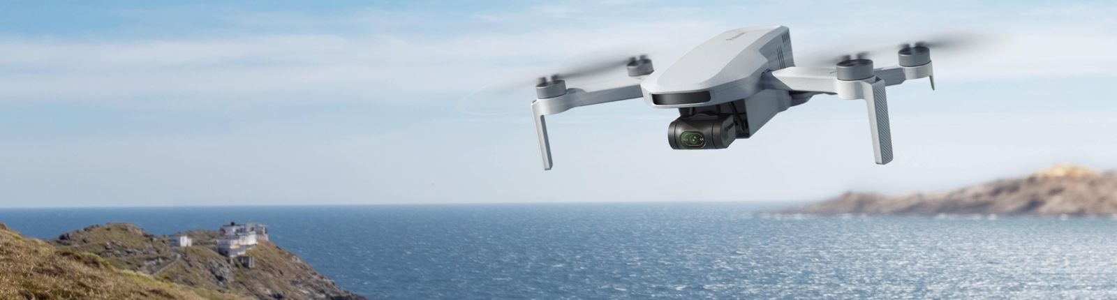 White drone camera hovering