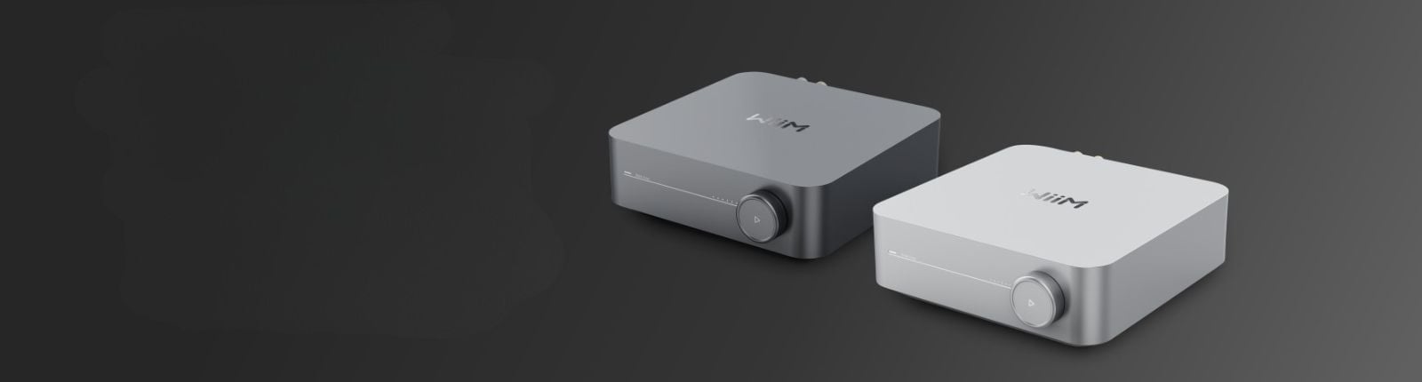 Two WiiM Amps one in white and one in grey