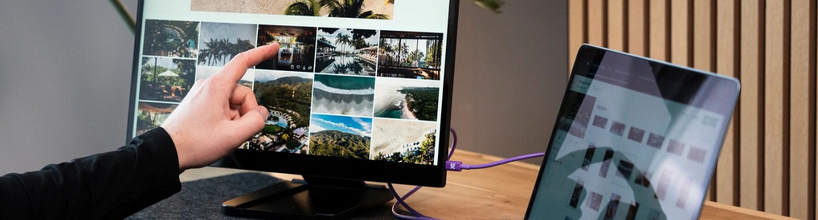 Person touching a computer monitor