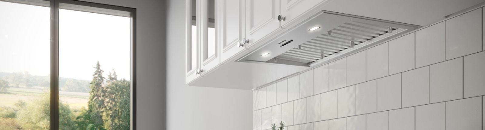 Stainless steel hood mounted in a kitchen